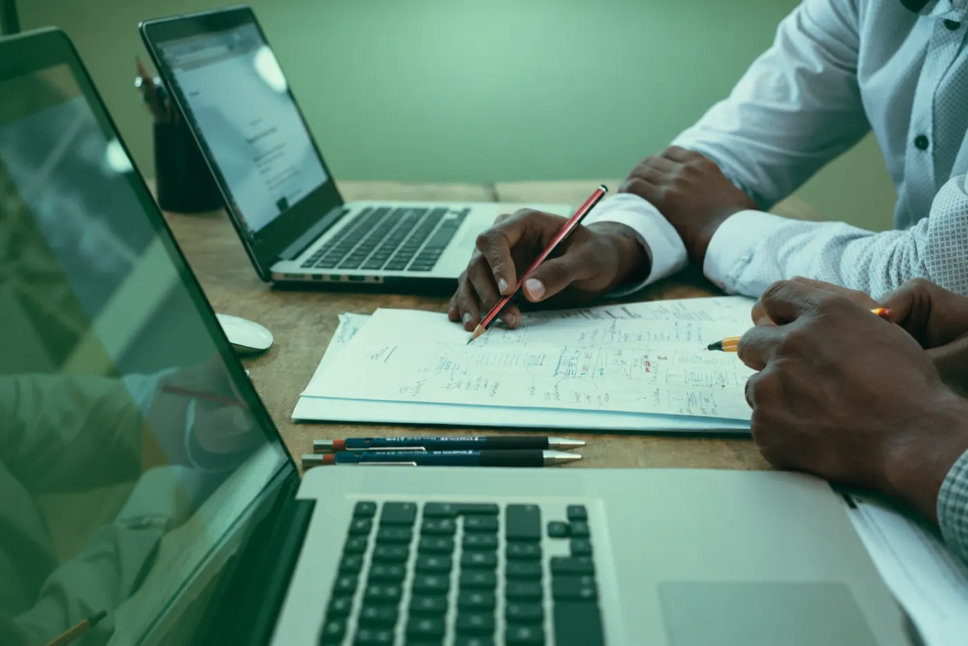 Advisors reviewing financial planning documents together